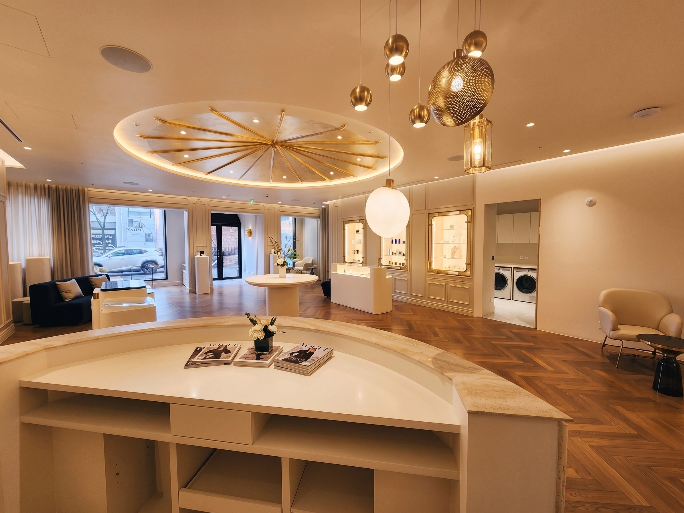 Lounge with a brass sunburst ceiling and herringbone floor